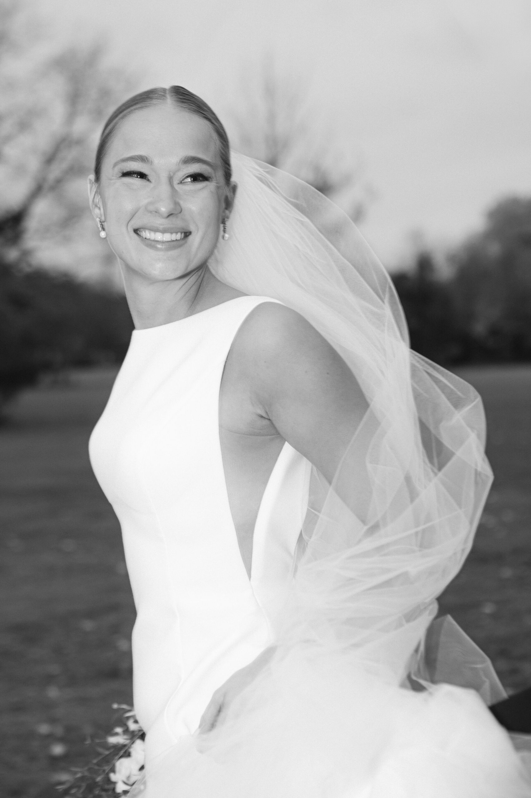 Bride portrait at Jan Serr Studio Milwaukee wedding with flowing veil and editorial black and white styling